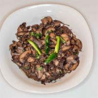Spicy Mushroom Tibs - Enguday Tibs (እንጉዳይ ጥብስ) · Mushroom sautéed with onion, garlic paste, and berbere
