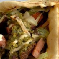 Falafel Pita · Served with lettuce, tomato, grilled onion, and zone white sauce on pita bread.
