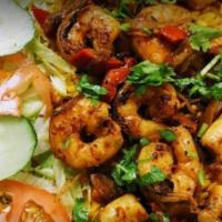 Grilled Shrimp Platter With  Grilled Onion & Pepper · Basmati rice garnished with lettuce and tomato &  zone white sauce.