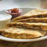 Chicken Quesadilla · Prepared with grilled onion, peppers, and melted cheese. Served with salsa and sour cream.