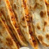Steak Quesadilla · Prepared with grilled onion, peppers, and melted cheese. Served with salsa and sour cream.