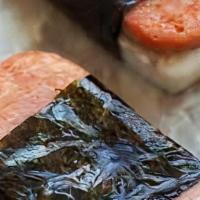 Spam Musubi · Pan seared Spam  placed on top of Packed rice and wrapped in nori (dried seaweed.)