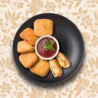 Cottage Cheese Fritters · Cottage cheese pieces dipped in a spiced chickpea flour batter and deep-fried till crisp and...