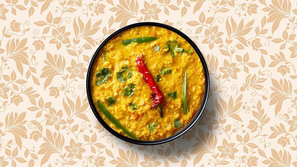 Tantalising Dal Tadka · A classic lentil soup made with the combination of yellow lentils and tomatoes tempered with Indian whole spices and finished with fresh coriander leaves. Served with a side of rice.