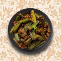 Okra Masala · Okra sautéed with, onions, ginger, garlic, fresh herbs, and spices. Served with a side of ri...