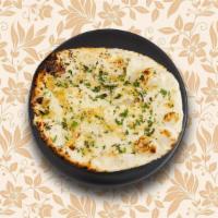 Garlic Flavoured Naan · Leavened bread pressed with minced garlic and freshly chopped cilantro baked in the tandoor.