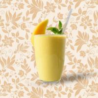 Mango Smoothie · Home-made yogurt drink churned with mango and nuts.