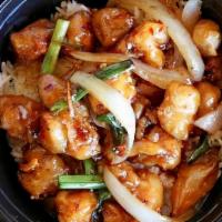 Orange Chicken · Stir-fry with yellow onions, orange peels, and red chili peppers.