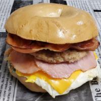 Tj * · Canadian Bacon, Bacon, Sausage, Egg, American Cheese & Veggie Cream Cheese on your choice of...