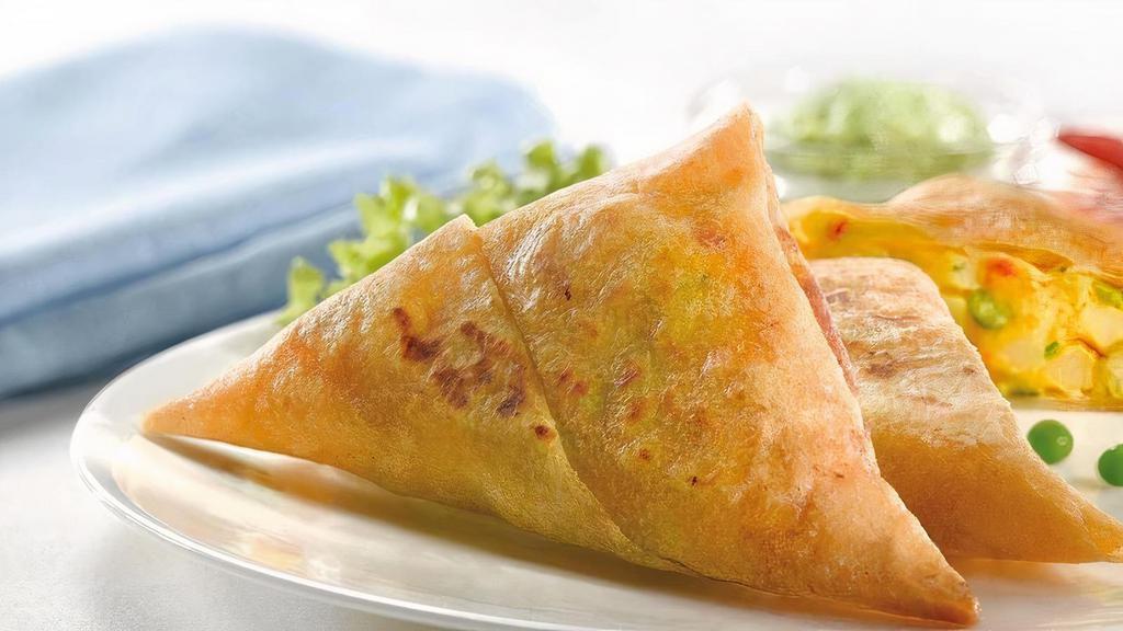 6 Piece Samosa · Fried pastry filled with potatoes, green peas and spices. Served with homemade sauce.