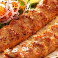 Ground Chicken Seekh Kabob · Ground chicken with seasoning and cheese. Served with tandoori bread, rice, salad and cilant...