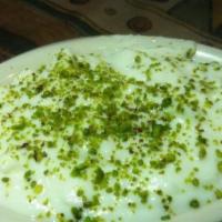 Rice Pudding · Rice pudding with pistachios and cardamom.