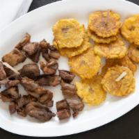 Carnitas Fritas ; Carne Saladas  · Incluye tostones o papas fritas