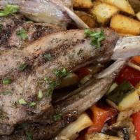 Lamb Chops · Grilled with vegetables and served with fried potatoes.