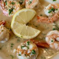 Shrimp Scampi · Large shrimp sautéed with garlic, butter, lemon juice and parsley. Served with rice.