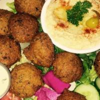 Falafel Plate · Fava and garbanzo beans ground together with vegetables and spices. Shaped and fried - serve...