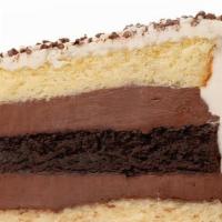 Black & White Fudge Cake · Alternating layers of vanilla & chocolate cake, filled with our homemade chocolate fudge ici...