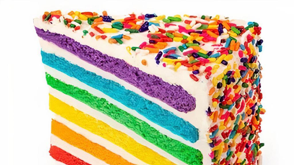 Vanilla Rainbow Cake Slice · Our best seller - six layers of rainbow-colored vanilla cake filled high with a sweet vanilla icing & covered with rainbow sprinkles