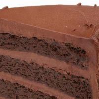 Fudge Cake · Chocolate fudge cake filled high with our signature homemade chocolate fudge & slathered in ...