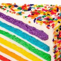 ** Vanilla Rainbow ** · Our best seller - six layers of rainbow-colored vanilla cake filled high with a sweet vanill...