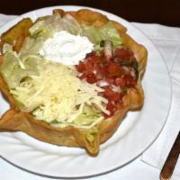 Taco Salad · Crispy flour tortilla bowl filled with iceberg lettuce, cheese, pico de gallo, sour cream, c...