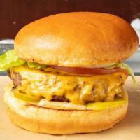 Angus Burger · 1/3 lb grass American fed Angus beef with onions, lettuce, tomato, pickles & American cheese...