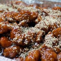 Sesame Chicken · Batter fried chicken cube in a homemade sauce and topped with sesame