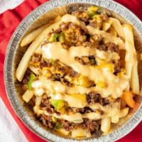 Loaded Fries · Golden fries loaded with premium beef, sweet onions, peppers, and topped with cheese and our...