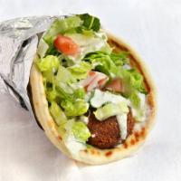 #12 Falafel Wrap · Deep fried veggie balls made fresh to order wrapped with lettuce, tomato, cucumbers in pita ...