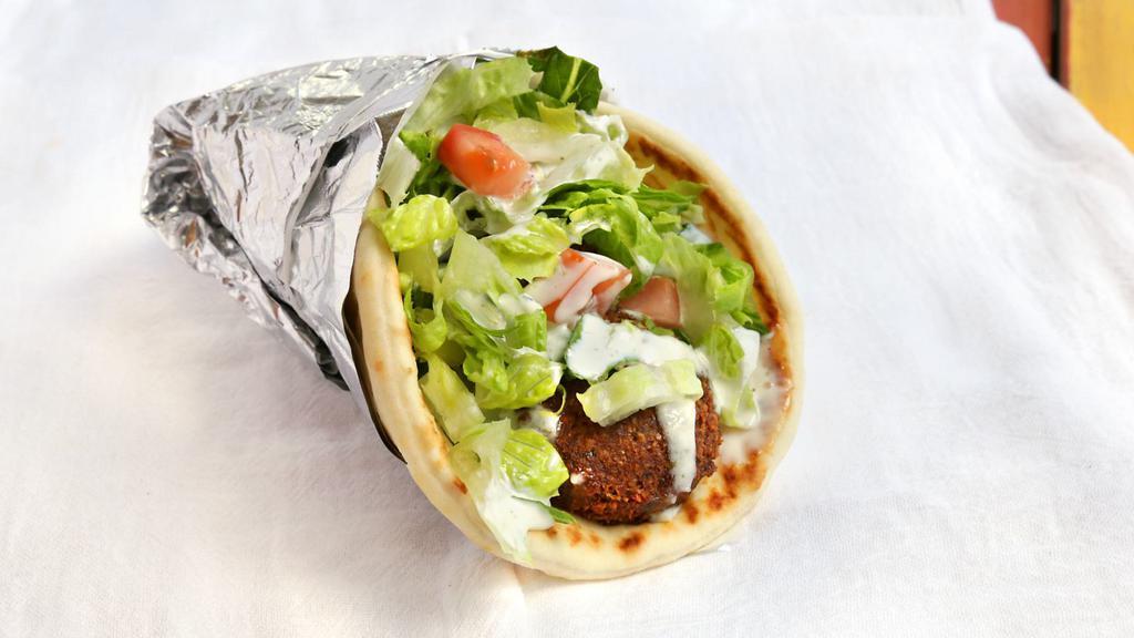 #12 Falafel Wrap · Deep fried veggie balls made fresh to order wrapped with lettuce, tomato, cucumbers in pita bread.