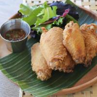 Chicken Wings · House marinated fried chicken served with our house chili sauce
