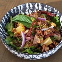Crispy Duck Salad · Crispy duck mixed with fresh lime juice, ginger, red onion, cilantro, chili paste, chunk pin...