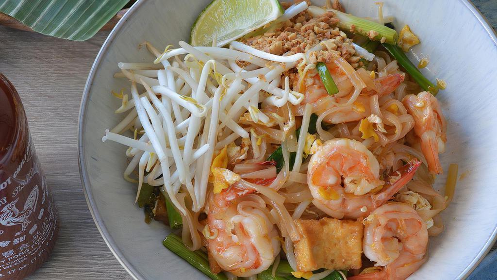 Pad Thai · Gluten free. Thin rice noodle with sweet tangy tamarind sauce, egg, scallion, sweet radish and bean sprouts. Crushed peanuts and lime on the side.