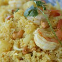 Pineapple Fried Rice · Jasmine rice, shrimp, chicken, scallions, pineapple, curry powder, onion, cashew nut and egg...