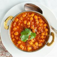 Channa Masala · Chickpeas and potatoes cooked with spices and a hint of tamarind.