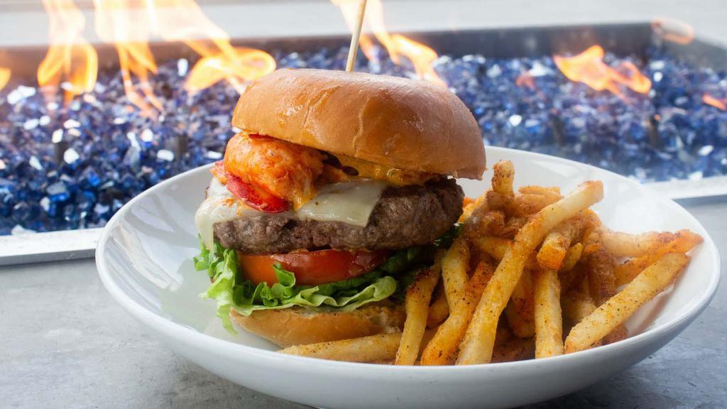 Volt Burger · Hand packed half pound patty, cheddar cheese, lettuce, caramelized onions, tomato, garlic aioli.