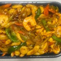 Chicken And Shrimp Szechuan Style · Hot and spicy. Chicken and shrimp with celery, carrot, onion and bell pepper in special spic...