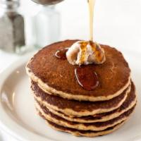 Tall Stack Pancakes · Four buttermilk pancakes with cinnamon brown sugar butter and 100% pure organic maple syrup.