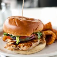 Grilled Chicken Sandwich · With lettuce, tomato, onion, and the happy cucumber spicy pickles.