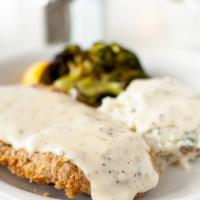 Chicken Fried Steak · Certified Angus Beef® sirloin, house-made red-eye cream gravy, and choice of two sides.