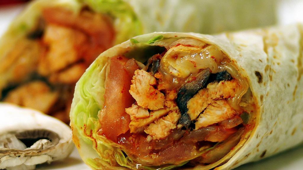 Hot & Spicy Chicken Wrap · Grilled chicken, caramelized onion, pepper, mushroom melted provolone cheese, lettuce, tomato, hot sauce on tortilla wrap.