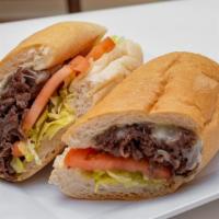 Philly Steak & Cheese · 5oz ribeye steak, provolone cheese, grilled onion, lettuce, tomato, mayo on sub.