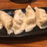 Gyoza Dumplings (6) / 饺⼦ · Steamed or fried pork dumplings.