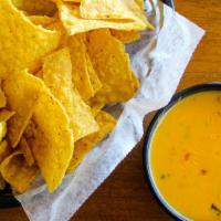 Chile Con Queso · Gluten free. Served with tortilla chips.