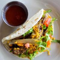 Steak Tacos · Marinated beef tips in a mild or spicy Mexicana sauce of roasted tomato, onion, cliantro & j...