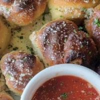 Garlic Knots · Bread knots brushed with olive oil and garlic.