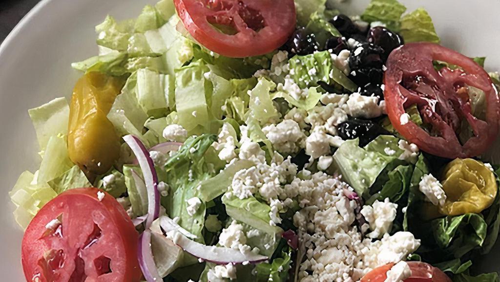 Mediterranean Salad · Romaine lettuce and spring mix topped with Kalamata olives, red onions, feta cheese, cucumber, and pepperoncini.