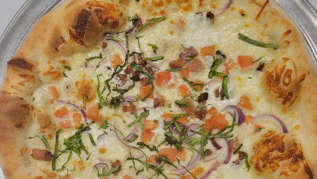 Pancetta Pizza · Pancetta (Italian bacon), mozzarella, red onions, diced tomatoes, fresh basil and fresh Bufala mozzarella.