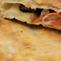 Meatlover Calzone · Stuffed with mozzarella, ricotta, ham, pepperoni, Italian sausage, and sliced meatballs.