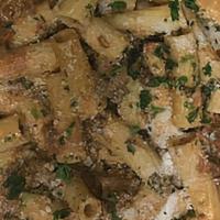 Rigatoni Bolognese · Rigatoni pasta topped with a homemade meat sauce with a touch of heavy cream.